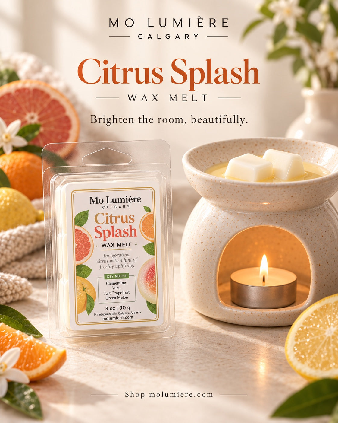 Mo Lumière Citrus Splash wax melt beside a ceramic wax warmer