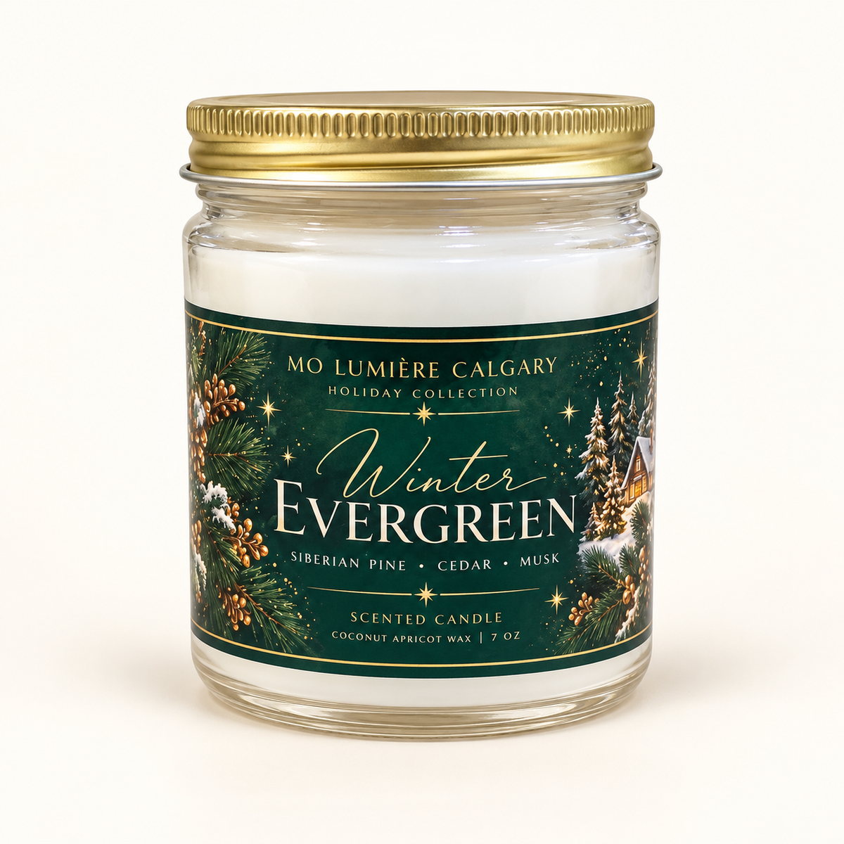 Winter Evergreen 7 oz holiday candle in clear glass jar with gold lid and forest green label